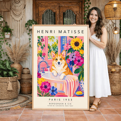 A vertical maximalist art print styled as a Henri Matisse exhibition poster. A tan and white Pembroke Welsh Corgi dog with large ears stands in a white bathroom sink under a running silver faucet. The room features pink walls and is filled with large sunflowers and pink and purple blossoms. A pink and white striped towel hangs from the side of the sink. A window in the background looks out onto a leafy green garden. Bold black text at the top and bottom
