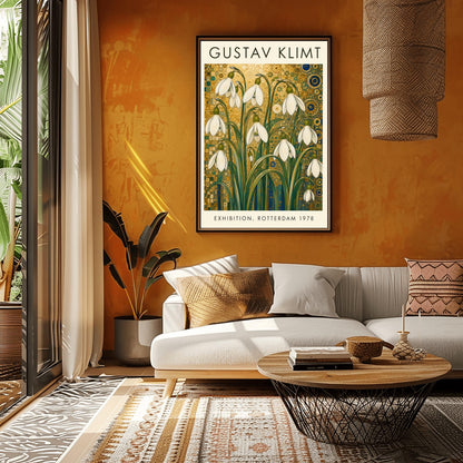 A vertical retro exhibition poster for Gustav Klimt featuring a wide cream-colored border. The central image shows an intricate Art Nouveau illustration of a cluster of delicate white snowdrop flowers with long green leaves reaching upward. The background is an opulent, decorative tapestry of metallic gold patterns, featuring detailed concentric circles, swirling spirals, and tiny mosaic tiles accented with hints of blue and teal.
