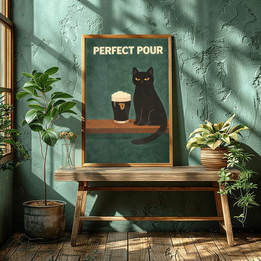 A vertical modern illustration of a sleek black cat with yellow eyes sitting on a wooden bar ledge next to a pint of Guinness. The text "PERFECT POUR" is written in bold cream letters at the top. The background is a dark, textured teal-green.