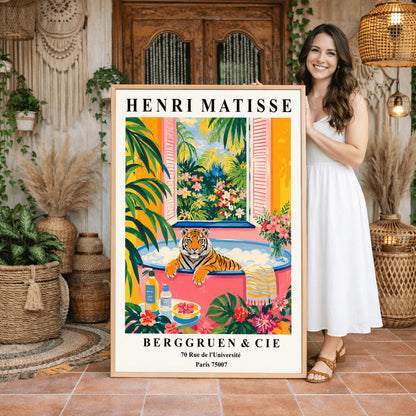 A vertical minimalist fine art exhibition poster in the style of Henri Matisse, featuring a wide white border layout. In the center, a simple black line drawing illustrates a tiger in a crouching, stalking pose. The illustration is set against a vibrant mustard yellow background block, framed by flat paper-cut abstract shapes including a royal blue coral leaf on the left and a terracotta red shape on the right against a solid white backdrop.