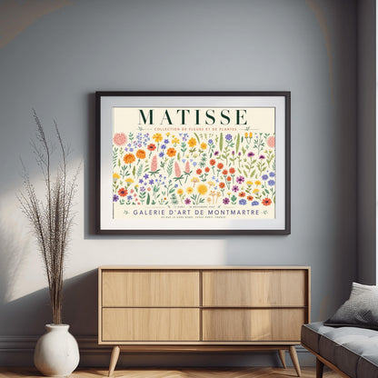 A vertical gallery exhibition poster with a warm cream border. Bold black text at the top reads "HENRI MATISSE". The central artwork is a rectangular block with a solid terracotta-orange background, featuring a cream silhouette of an abstract, four-petaled flower with a circular center. Below the block, black text reads "PAPIERS DÉCOUPÉS" and "FLEUR". The bottom of the poster finishes with the text "BERGGRUEN & CIE - 70 RUE DE L'UNIVERSITÉ - PARIS VII".