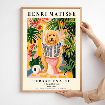 A vertical fine art exhibition poster in the style of Henri Matisse featuring a wide cream border. Bold black text reads "HENRI MATISSE" at the top and "BERGGRUEN & CIE" at the bottom. The central painting humorously shows a fluffy golden doodle dog sitting on a pink toilet while reading a newspaper, surrounded by vibrant green palm leaves, tropical flowers, and a toilet paper roll on the floor.