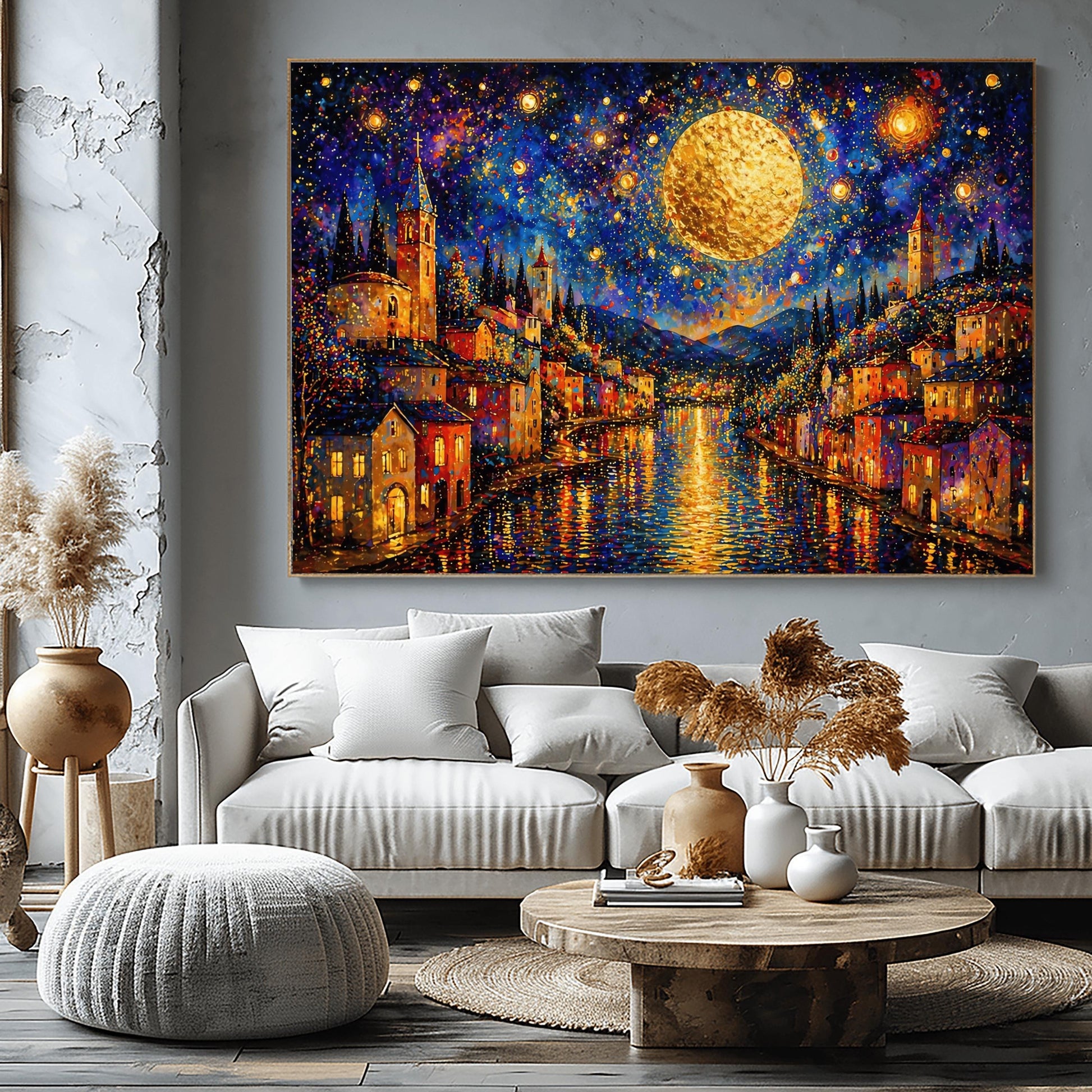 A horizontal art print in a decorative mosaic style inspired by Gustav Klimt. A coastal town with warm-lit houses and tall church towers lines both sides of a dark blue canal. A massive, glowing golden moon hangs in a deep indigo sky filled with swirling stars and shimmering golden circles. The lights of the town and the moon reflect brilliantly on the rippling water. The entire scene is composed of intricate, sparkling patterns and vibrant jewel-toned colors.