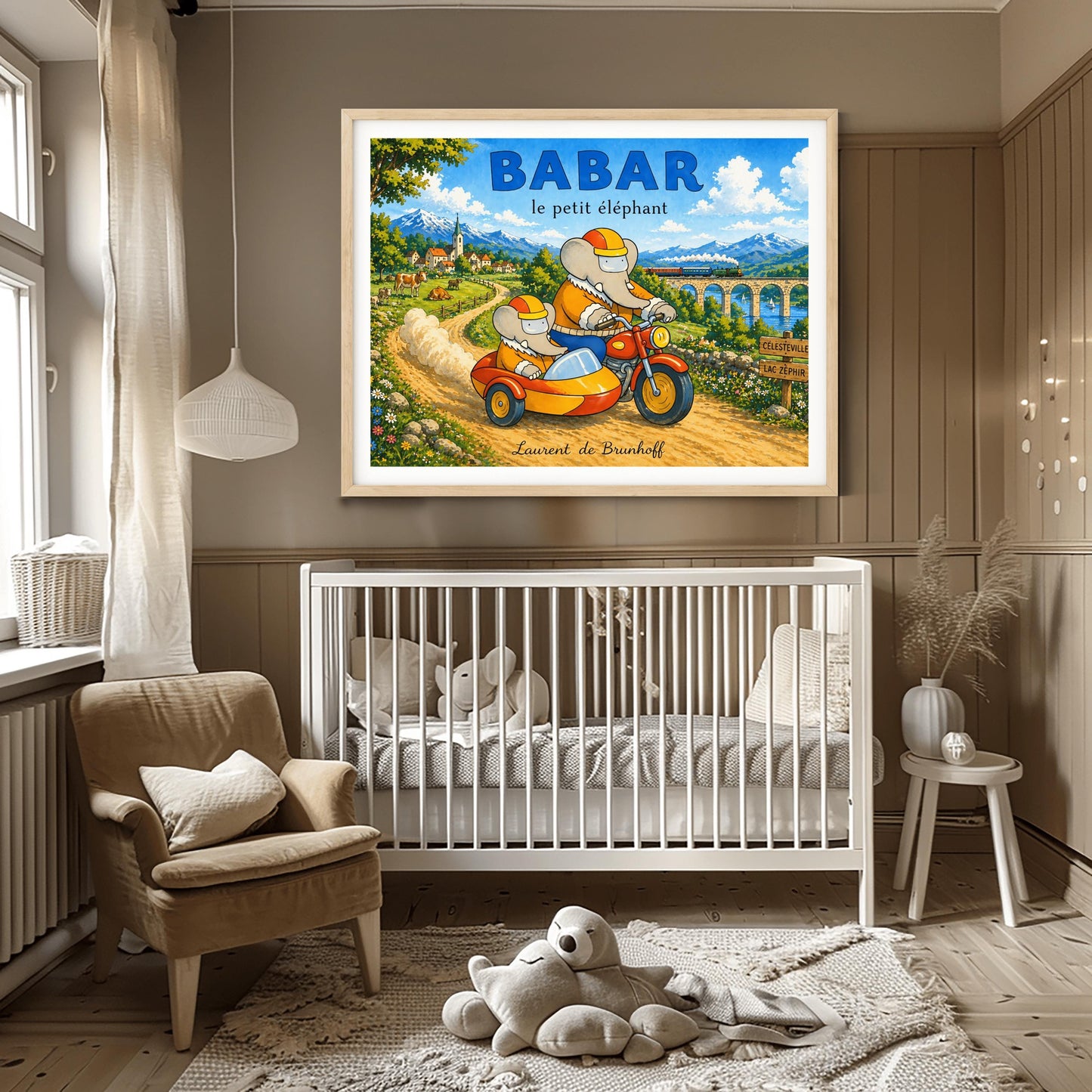 A horizontal watercolor illustration featuring Babar the Elephant and a smaller elephant riding a red motorcycle with a yellow sidecar down a dirt road. Both wear orange jackets and orange-and-yellow helmets. They are driving away from a European village toward a valley where a train crosses a stone bridge. In the background are tall, snow-capped mountains under a blue sky. A wooden sign points toward "Célesteville" and "Lac Zéphir."