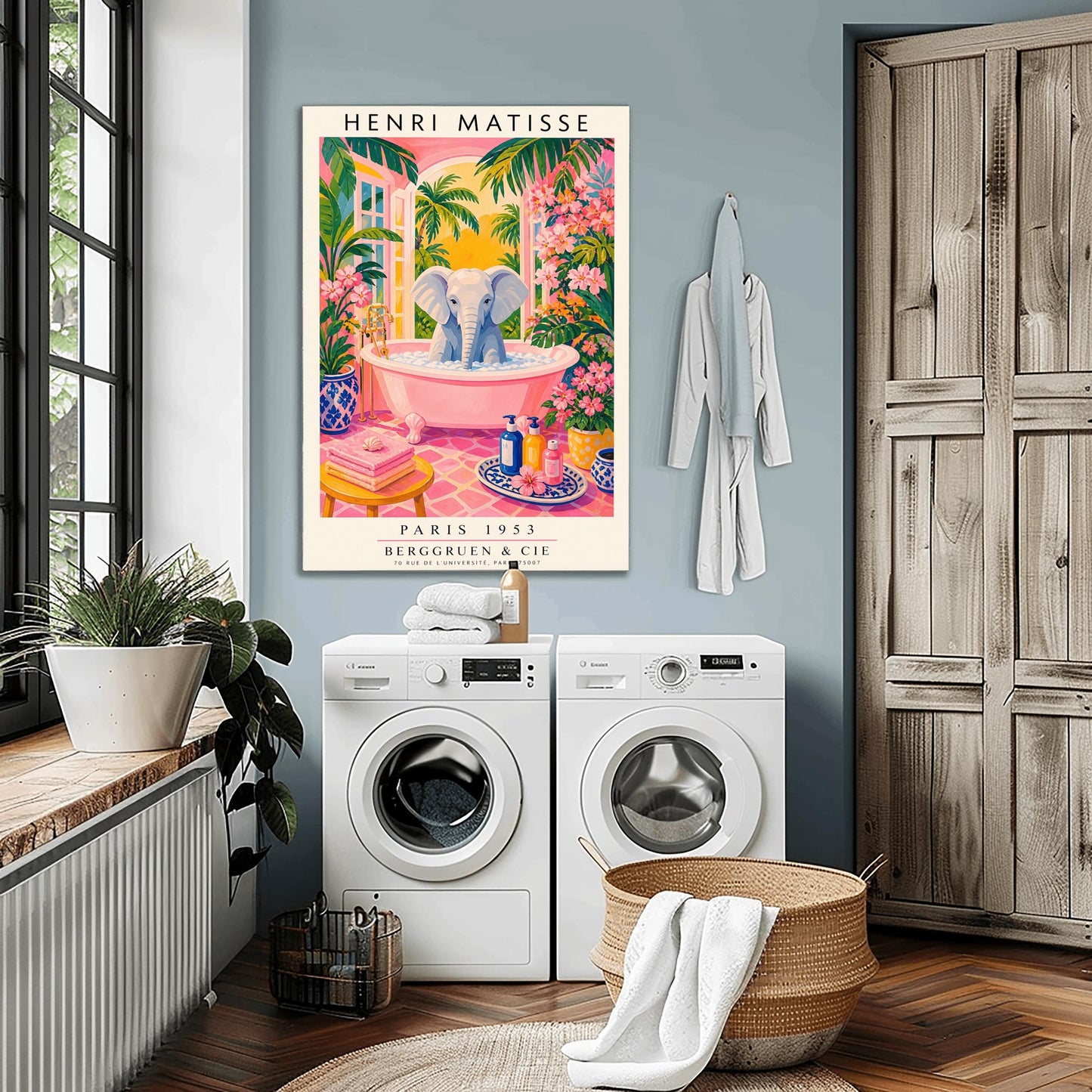 A vertical maximalist art print styled as a Henri Matisse exhibition poster. A light grey baby elephant is sitting in a large pink clawfoot bathtub filled with white bubbles. The bathroom features hot pink tiled floors, vibrant pink flowers, and lush green tropical plants. In the background, an arched window shows a bright golden sunset with palm tree silhouettes. A small yellow stool with towels and various blue and yellow ceramic vases decorate the room.