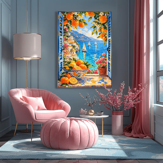A vertical painterly illustration looking through open blue shutters at a coastal town with a yellow-domed cathedral and a blue sea with sailboats. In the foreground, a ceramic bowl holds oranges and lemons on a stone windowsill next to a pot of pink flowers.