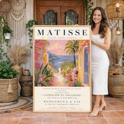 A French exhibition poster titled "MATISSE" at the top, featuring a pastel-toned painting of a Mediterranean coastal scene. A pathway lined with pink flowers, green agave plants, and yellow villas leads toward a blue sea and distant hills under a pink and gold sunset sky. A tall palm tree stands on the right. Elegant typography below the artwork text reads "Exposition Landscape at Collioure, Berggruen & Cie, Paris."