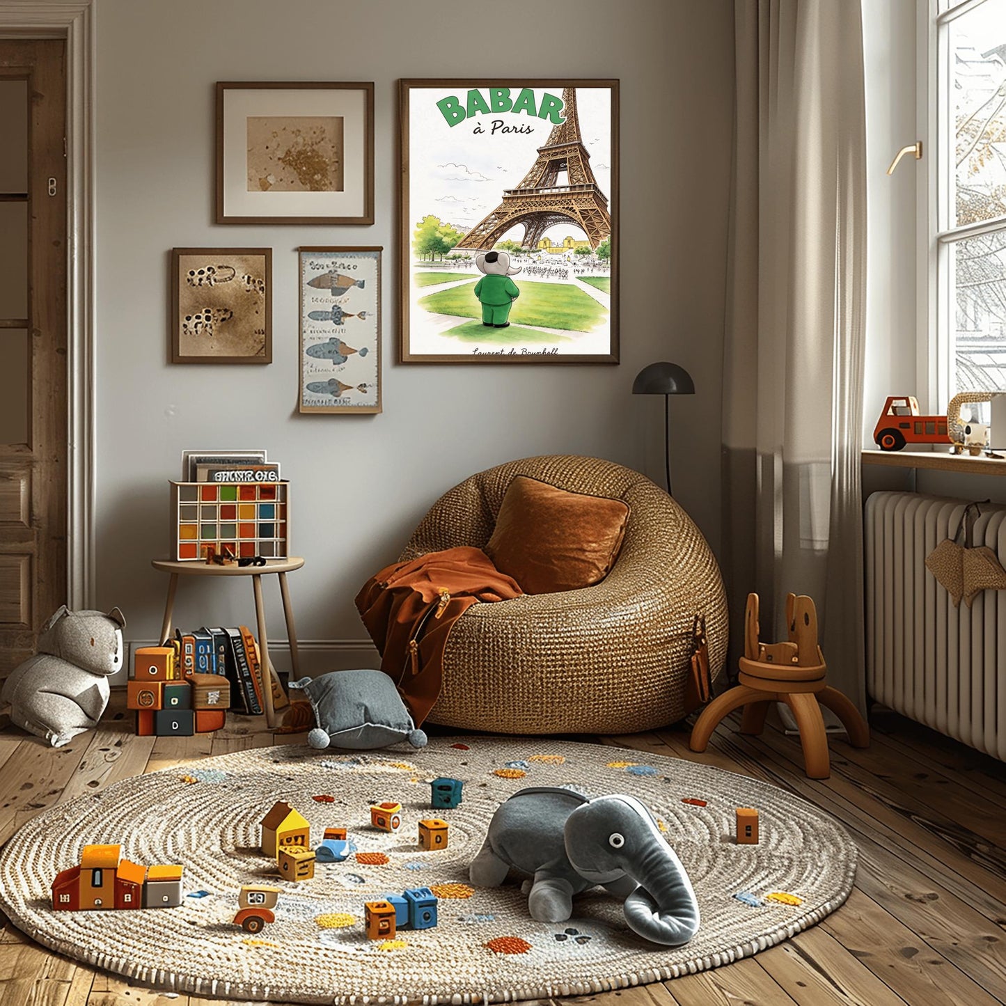 A vertical art print titled "BABAR à Paris" in large green letters. A grey elephant, Babar, seen from behind wearing a green suit and black cap, stands on a green lawn looking toward the massive Eiffel Tower. The scene includes green trees, a distant cityscape with crowds of people, and a soft blue sky. The artist's name, "Laurent de Brunhoff," is printed in script at the bottom.