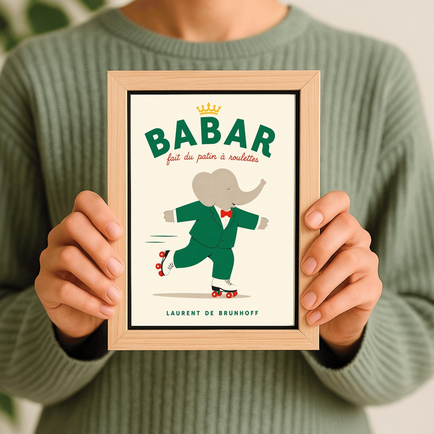 A vertical storybook-style art print of Babar the Elephant roller skating against a cream background. Babar is wearing his signature green suit and red bow tie. He is balanced on white roller skates with red wheels, with one foot lifted behind him. The top of the print features the word "BABAR" in large green letters above the red script text "fait du patin à roulettes" and a small gold crown. The name "LAURENT DE BRUNHOFF" is printed at the bottom.