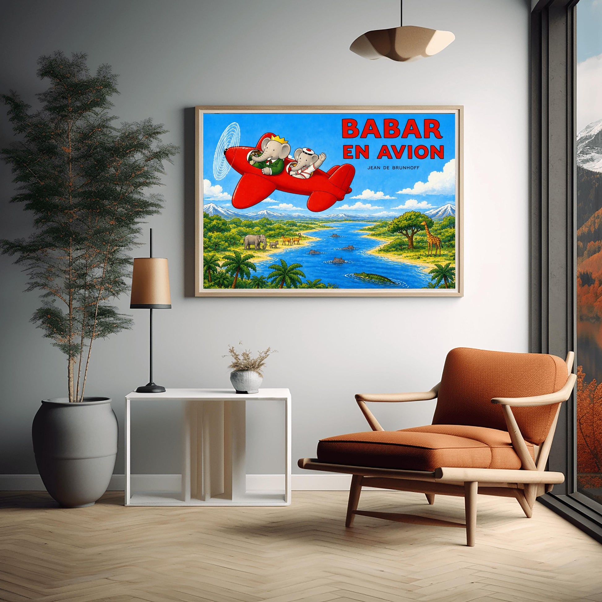 A horizontal watercolor-style illustration of Babar the Elephant flying a bright red propeller plane. Babar wears a green suit and crown, while a smaller elephant in a white sailor suit waves from the back seat. They fly over a vibrant safari landscape with a winding blue river filled with hippos and a crocodile. On the riverbanks are giraffes, antelopes, elephants, and palm trees. Snow-capped mountains rise in the distance under a blue sky. Large red text reads "BABAR EN AVION."