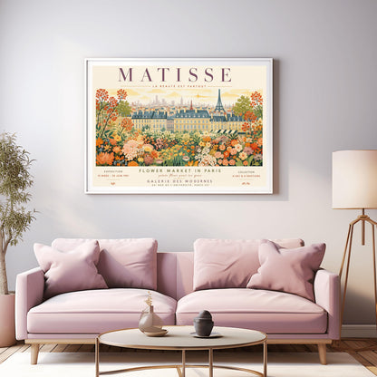 A French art exhibition poster titled "MATISSE" across the top. The central illustration shows a sprawling field of dense, colorful wildflowers in shades of orange, yellow, and white. In the background, classic Parisian buildings and the silhouette of the Eiffel Tower stand under a soft yellow sky. The text at the bottom reads "Flower Market in Paris, Galerie des Modernes, 24, Rue de l'Université, Paris."