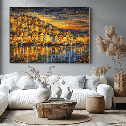 A horizontal landscape art print in the style of Gustav Klimt, depicting a coastal village at dusk. A dense cluster of golden, mosaic-patterned houses sits on a hill overlooking a harbor. Several traditional wooden sailboats are anchored in the water, which reflects the warm gold light of the buildings. The sky above is a dark indigo filled with golden swirling patterns and stylized stars. The overall composition is rich with gold leaf textures and intricate decorative details.