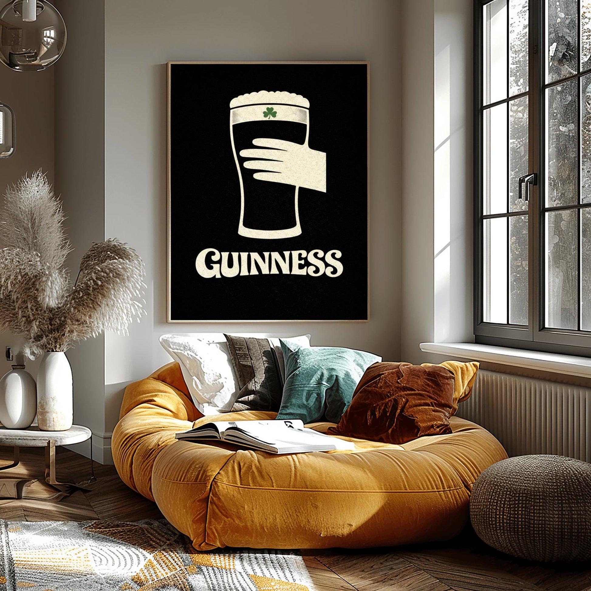 A vertical minimalist graphic design on a textured black background. A cream-colored hand is shown holding a pint of Guinness stout, with the glass itself created out of negative space. A small green shamrock is on the foam. The word "GUINNESS" is in cream text at the bottom.