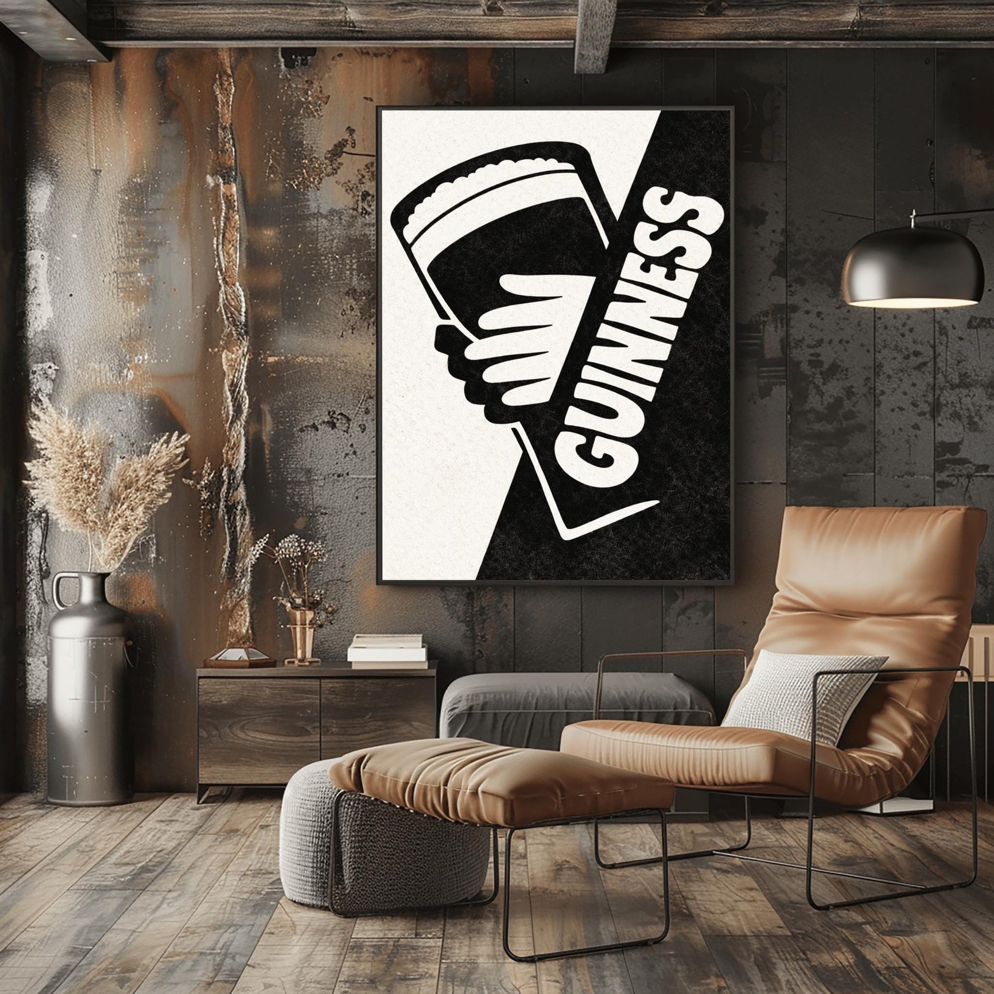 A vertical minimalist graphic divided diagonally into cream and black sections. A white hand holds a pint of Guinness against the black side. The word "GUINNESS" is written vertically in bold white text along the diagonal split.