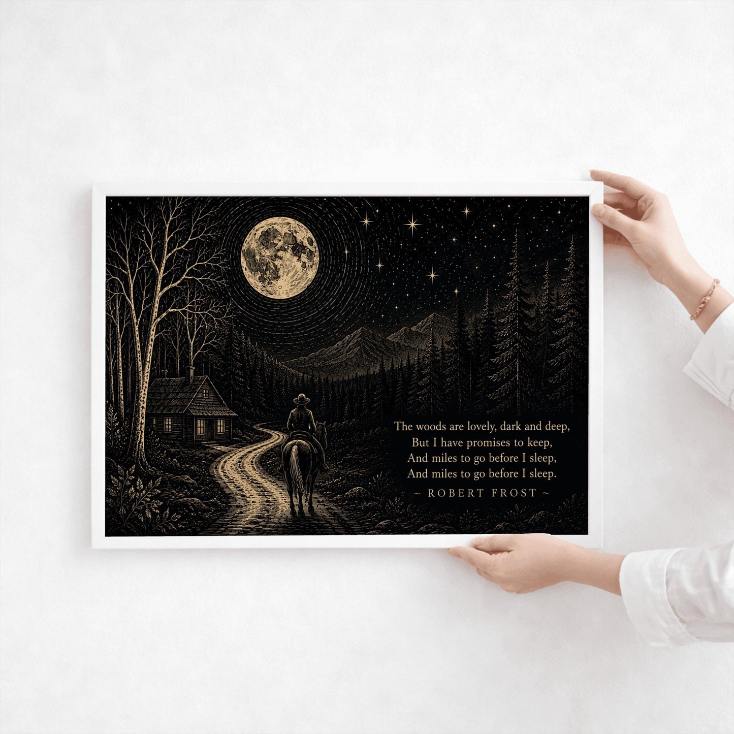 A wide horizontal art print with gold linework on a black background. A man on a horse rides toward a small cabin with lighted windows. The path is flanked by birch and pine trees, leading toward a background of mountains. A large, detailed moon and several bright stars fill the sky. On the right side, the final lines of Robert Frost’s poem "Stopping by Woods on a Snowy Evening" are printed in gold serif typography.