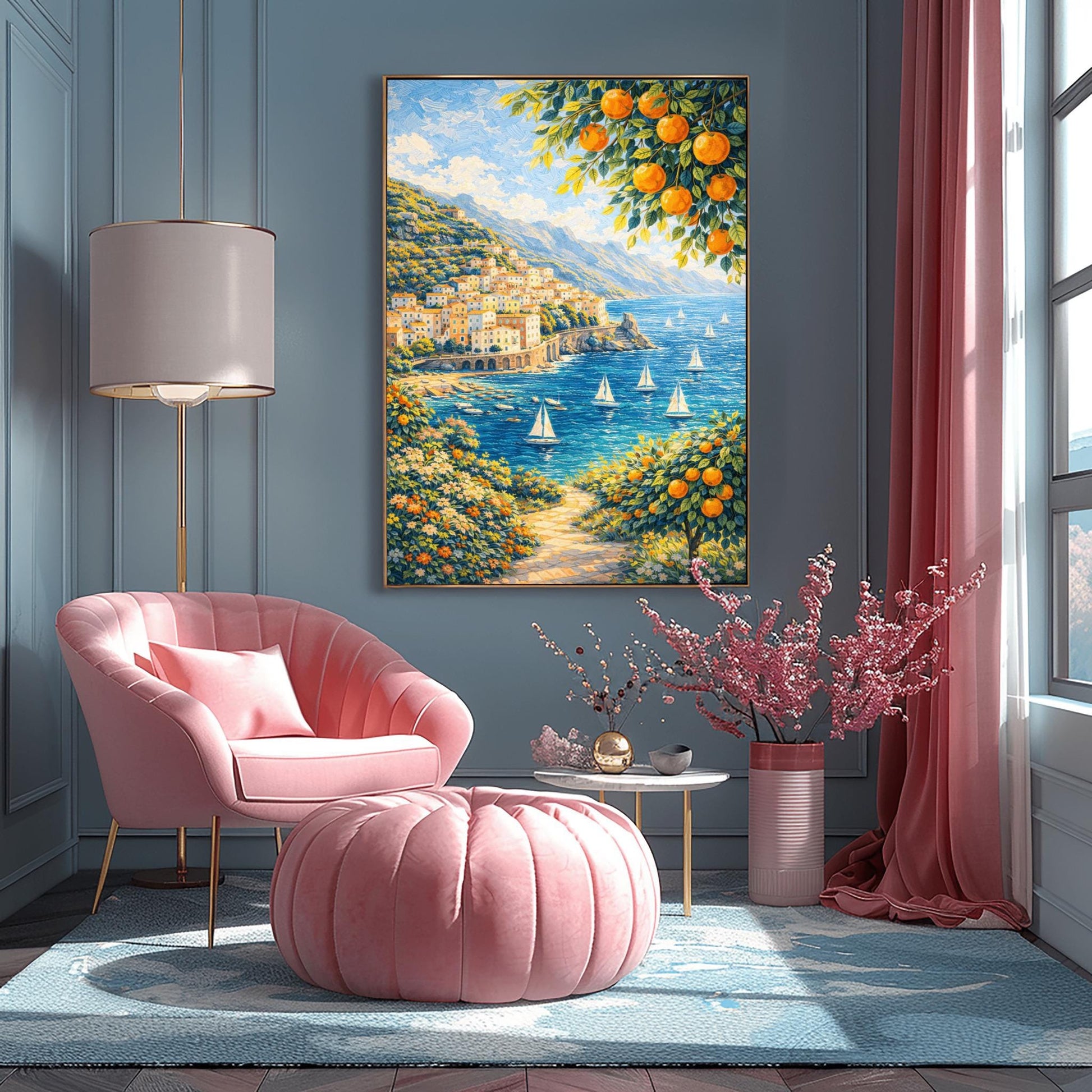 A vertical painterly illustration of a Mediterranean village built into a steep mountainside overlooking a blue sea with many white sailboats. Branches with oranges frame the top and bottom right. A flowered path in the foreground leads toward the water under a bright sky.