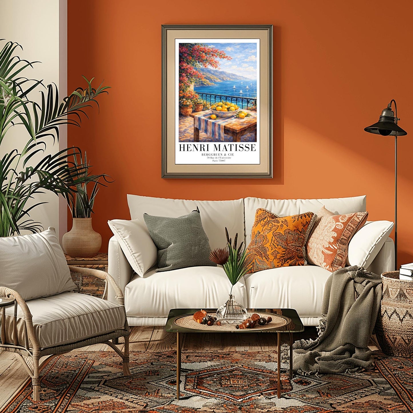 A vertical painterly illustration of a stone terrace with a black iron railing. A pink bougainvillea tree hangs from the top left over a wooden table with a bowl of oranges and lemons. Beyond the railing is a blue sea with white sailboats and a distant mountainous coastline.