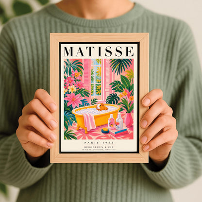 A vertical maximalist art print styled as a Henri Matisse exhibition poster. A small orange and white guinea pig sits in a bright yellow clawfoot bathtub filled with white bubbles. The bathroom is vibrant with pink walls and a pink patterned floor. Lush green monstera plants and pink flowers frame the scene. In the foreground, soap bottles sit on a stack of books next to a pink vase. An open window with pink shutters shows tropical trees in the background.