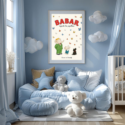 A vertical retro fine art exhibition poster titled "BABAR regarde les papillons" on a wide cream border. The top "BABAR" text is printed in a bold red font. The illustration shows an elephant wearing a crown and green suit standing next to a smaller elephant reaching up toward a sky filled with dozens of colorful blue, yellow, orange, and white butterflies. A small black dog sits patiently on the ground looking up at them. The name "Laurent de Brunhoff" anchors the bottom.