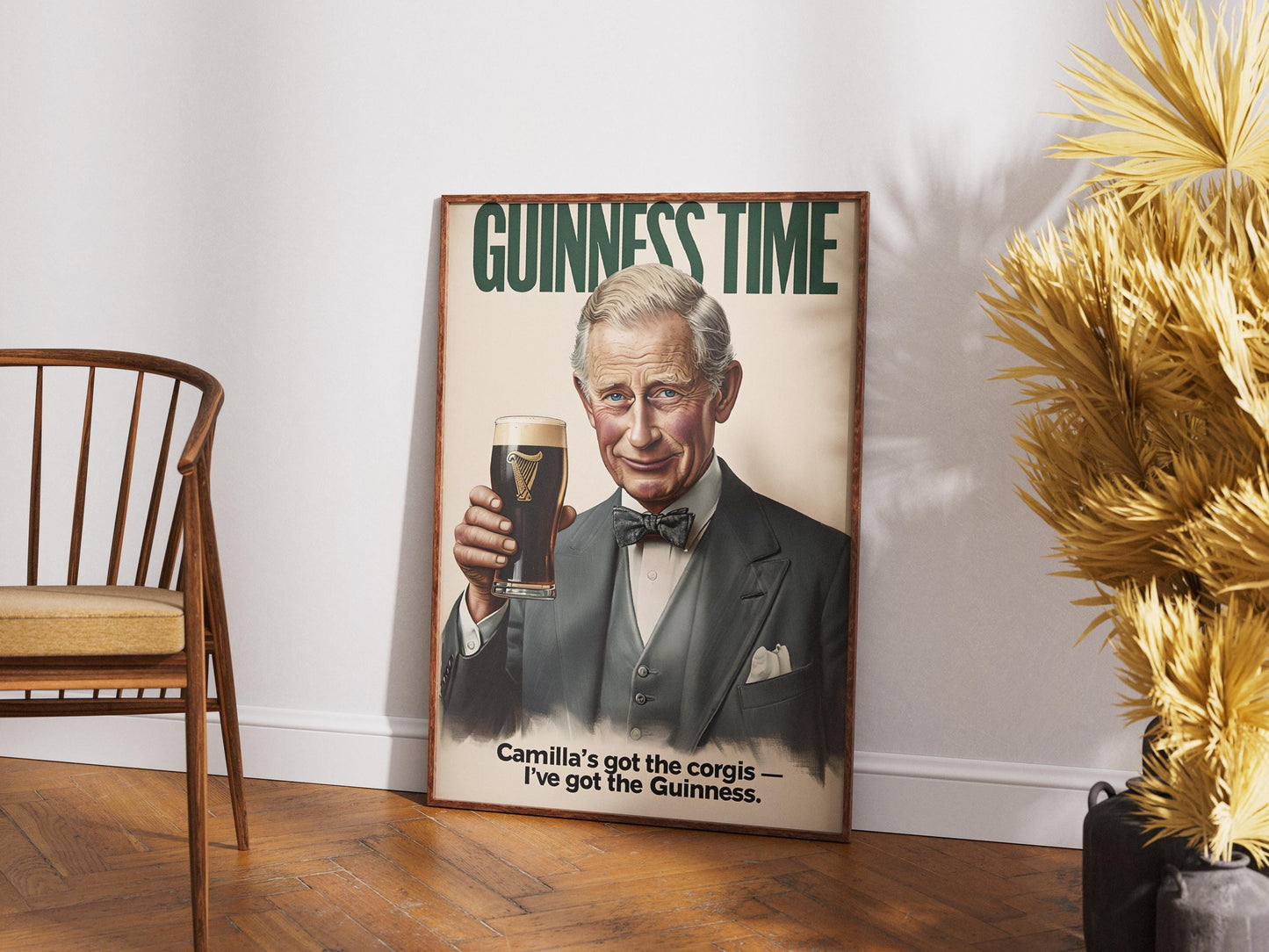 A humorous art print featuring King Charles III holding a classic pint of Guinness. The illustration shows him smiling with the iconic dark stout and creamy head. The text 'GUINNESS TIME' appears at the top, and 'Camilla's got the corgis — I've got the Guinness.' at the bottom, adding a witty royal touch. This unique print is ideal for pub or bar decor, a man cave, or as a quirky gift for fans of the British Royal Family and Guinness beer, blending humor with an iconic beverage