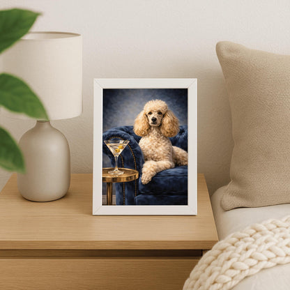 A vertical oil-style painting of a well-groomed white poodle sitting regally on a plush, dark blue velvet tufted armchair. To the left, a glass martini with two green olives on a toothpick sits on a round gold side table. The poodle has a calm, sophisticated expression. The background is a moody, dark grey-blue with visible painterly textures.