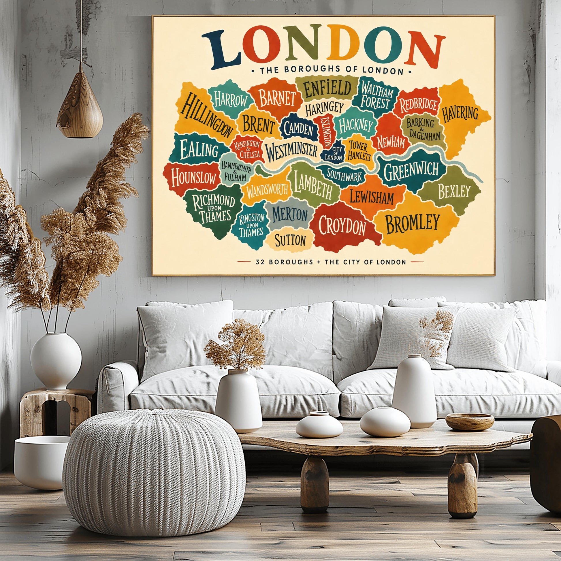 A horizontal vintage-style fine art exhibition poster mapping the boroughs of London. Set on a warm cream background with a wide border, the poster features a colorful, interlocking map of London's districts in shades of teal, orange, green, and yellow, with the River Thames running through the middle. A large, multicolored heading at the top reads "LONDON" and text at the bottom reads "32 BOROUGHS + THE CITY OF LONDON".