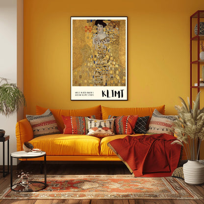 A vertical museum exhibition poster of Gustav Klimt's 1907 "Portrait of Adele Bloch-Bauer I." A woman is shown encased in a lavish gold dress with eye and triangle patterns against a shimmering gold mosaic background. The bottom border is cream with bold black text reading "ADELE BLOCH-BAUER I" and "KLIMT."