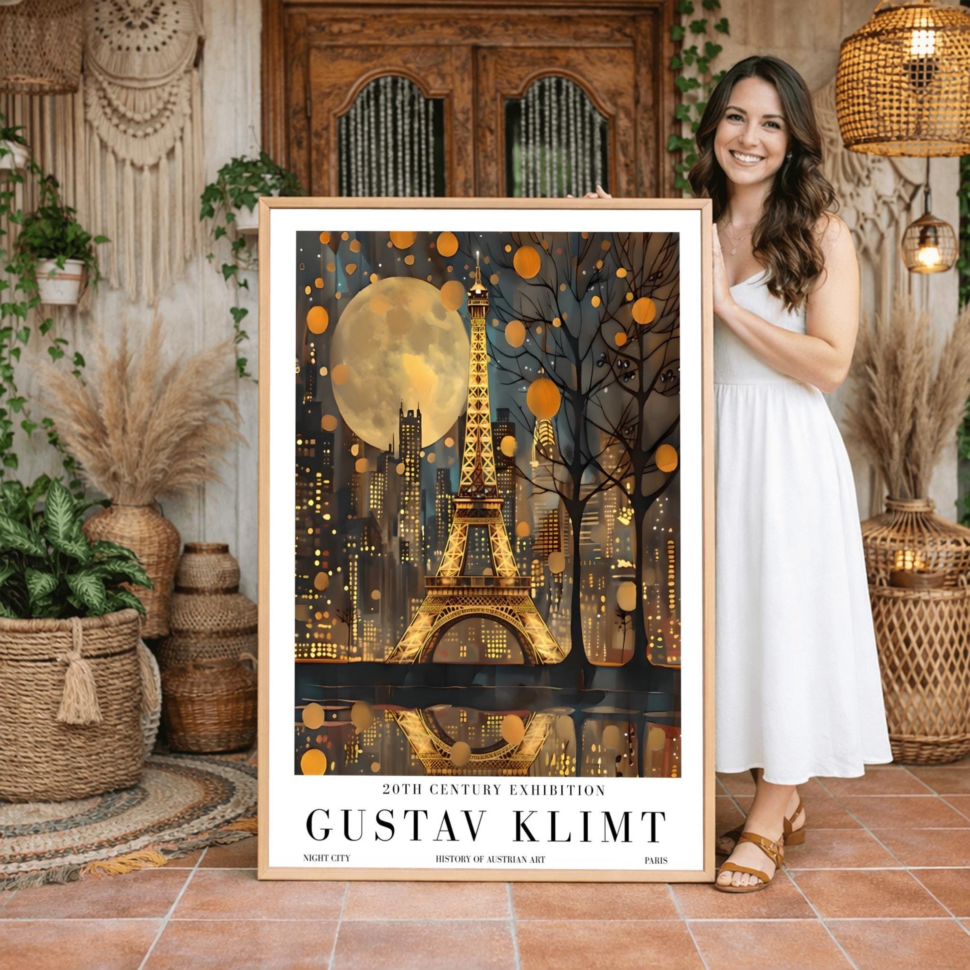 A vertical museum exhibition poster featuring the Eiffel Tower in Paris at night in the style of Gustav Klimt. The tower and city buildings glow in textured gold against a dark blue sky with a large, golden moon. Below the image, bold black text reads "GUSTAV KLIMT" and "20TH CENTURY EXHIBITION" against a white border.