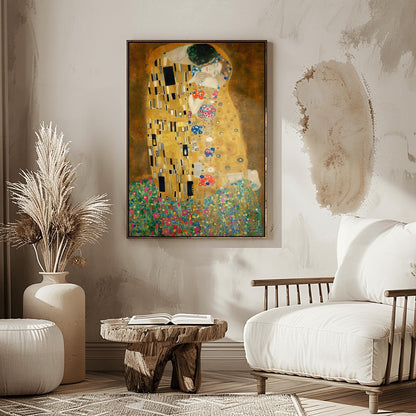 A vertical fine art print of "The Kiss" by Gustav Klimt. Two lovers are shown in an intimate embrace, their bodies covered in elaborate, decorative gold robes. The man's robe features black and white geometric shapes, while the woman's features colorful floral circles. They kneel on a lush bed of colorful wildflowers against a dark, shimmering gold background. The style is rich in mosaic-like patterns and Art Nouveau ornamentation.