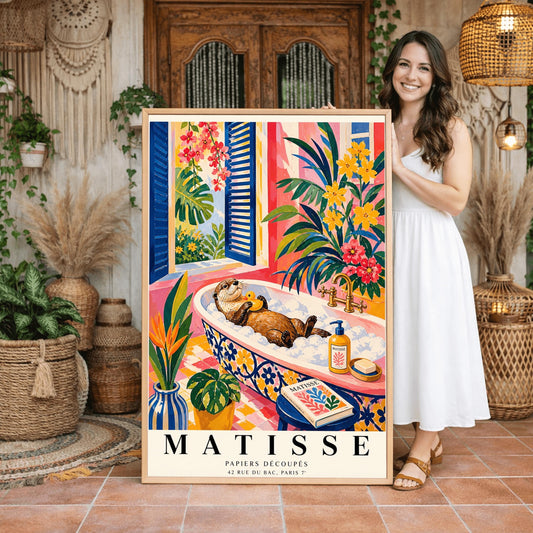 A vertical maximalist art print designed as a Henri Matisse exhibition poster. A brown otter floats on its back in a pink bubble bath, holding a small yellow rubber ducky. The bathtub has a blue and yellow floral pattern. The room is filled with vibrant tropical plants, pink walls, and yellow checkered tiles. A blue-shuttered window looks out onto a sunny garden. In the foreground, an art book and a striped vase are visible. Bold black text at the bottom reads "MATISSE PAPIERS DÉCOUPÉS"