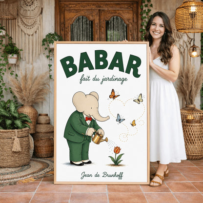 A vertical fine art exhibition poster featuring a classic illustration of Babar the Elephant by Jean de Brunhoff. Set within a wide white border on a textured off-white background, the elephant is shown in a green suit and red bowtie watering a red tulip with a gold can. Four butterflies fly nearby, leaving a dotted line that forms a heart shape. Bold green text at the top reads "BABAR fait du jardinage".