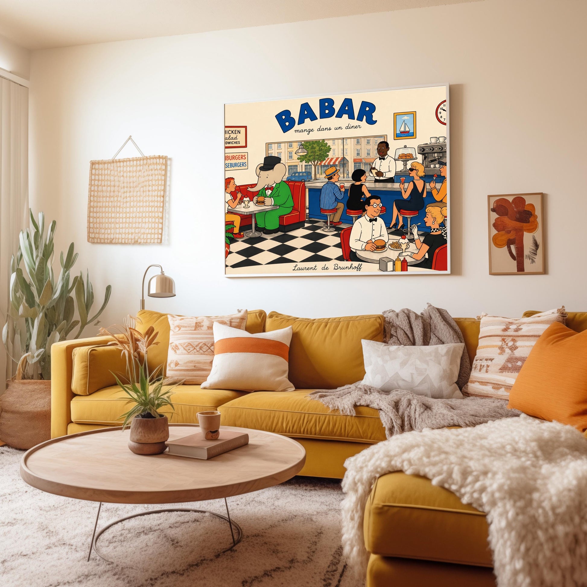 A colorful 1950s-style illustration poster titled "BABAR mange dans un diner" in bold blue and black lettering. The scene shows the interior of a lively retro diner with a black-and-white checkered floor. On the left, the cartoon elephant King Babar sits in a red leather booth wearing a green suit and top hat while eating a burger. Patrons sit at a long blue counter on stools and around tables eating burgers and sundaes, while a waiter takes orders.