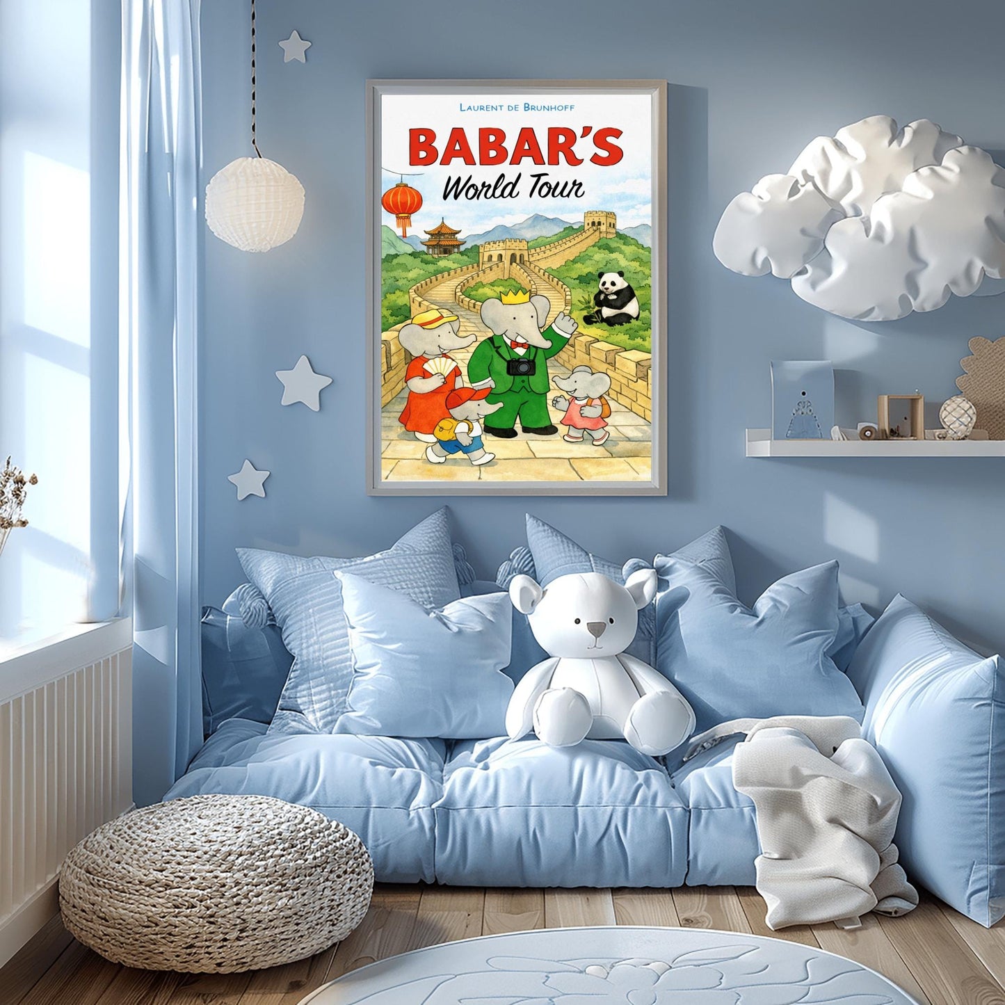 A vertical children's illustration poster titled "BABAR'S World Tour" in red and black letters. King Babar, wearing a green suit and a camera around his neck, stands on the Great Wall of China with his family. The wall curves through green mountains toward a pagoda in the distance. A giant panda sits in the grass to the right, and a red Chinese lantern hangs on the left. The name "Laurent de Brunhoff" is at the top.