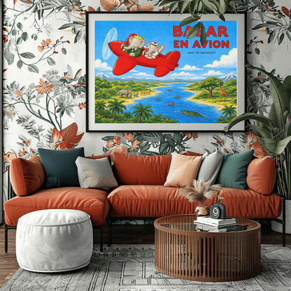 A horizontal watercolor-style illustration of Babar the Elephant flying a bright red propeller plane. Babar wears a green suit and crown, while a smaller elephant in a white sailor suit waves from the back seat. They fly over a vibrant safari landscape with a winding blue river filled with hippos and a crocodile. On the riverbanks are giraffes, antelopes, elephants, and palm trees. Snow-capped mountains rise in the distance under a blue sky. Large red text reads "BABAR EN AVION."