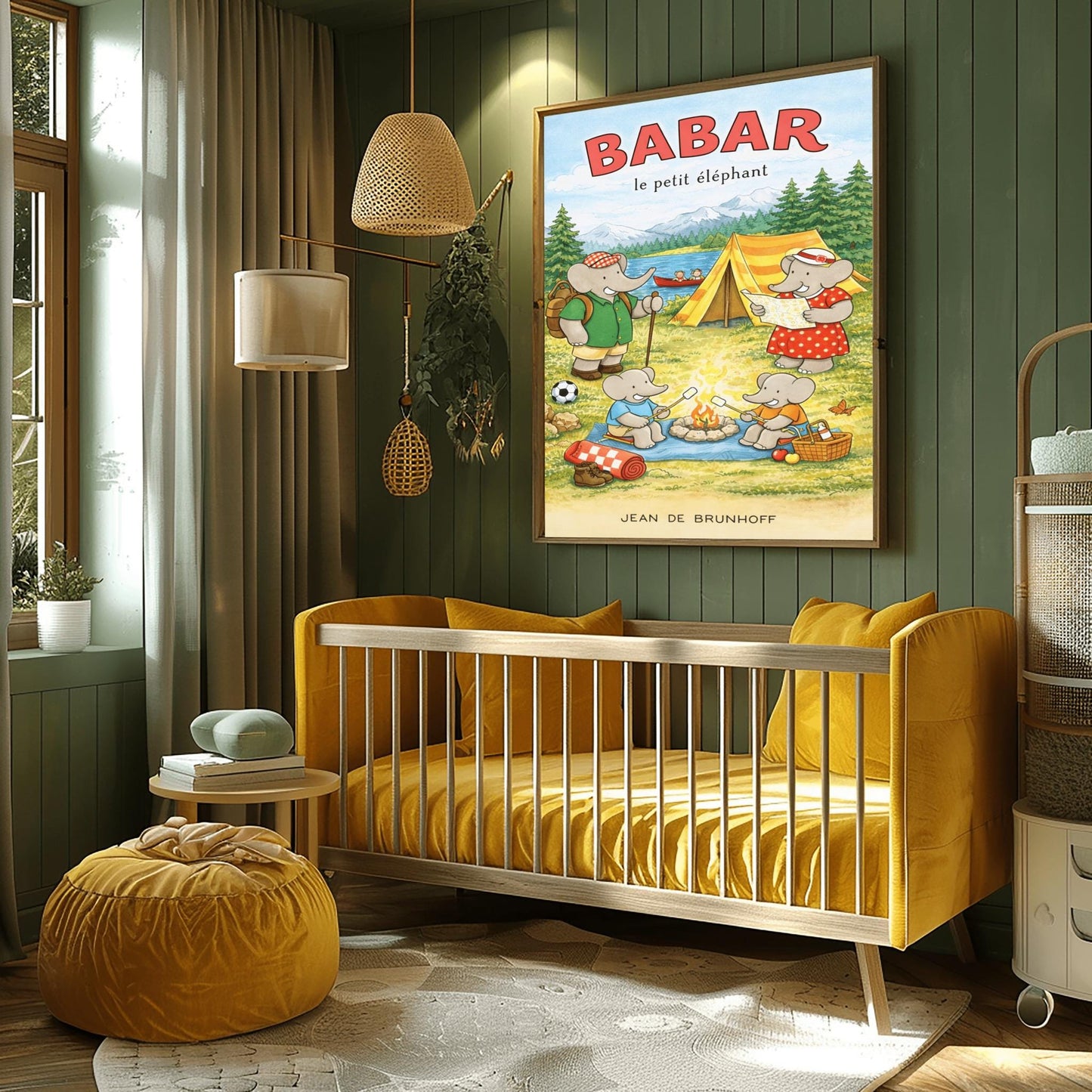 A vertical children's illustration poster titled "BABAR le petit éléphant" at the top in red. It features an elephant family camping by a lake. A large elephant (Babar) in a green shirt stands to the left with a backpack and walking stick. Another large elephant (Celeste) in a red polka-dot dress looks at a map near a yellow tent. Two small elephants sit in the foreground roasting marshmallows over a campfire. The background shows a lake with a red canoe and snow-capped mountains.