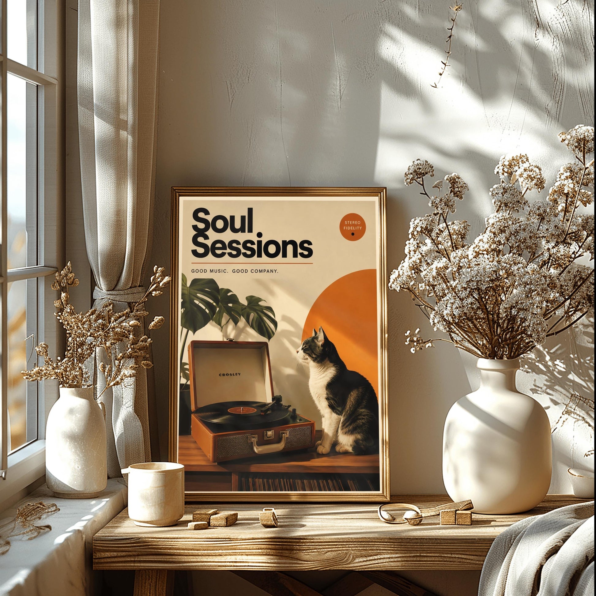 A vertical retro fine art poster titled "Soul Sessions" on a wide cream border. The design features a bold black heading at the top above the text "GOOD MUSIC. GOOD COMPANY." In the central artwork, a black and white tuxedo cat sits contentedly next to an open tan Crosley record player spinning a vinyl record. A large orange sun shape and a monstera plant decorate the background.