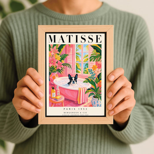 A vertical maximalist art print styled as a Henri Matisse exhibition poster. A black and white Boston Terrier dog sits in a pink bathtub filled with white bubbles. The bathroom features pink tiled floors and walls, decorated with lush green tropical plants and vibrant pink flowers in floral vases. A window with pink shutters in the background looks out onto palm trees and a blue ocean. In the foreground, soap bottles and a yellow bar of soap sit on a small pink stool.