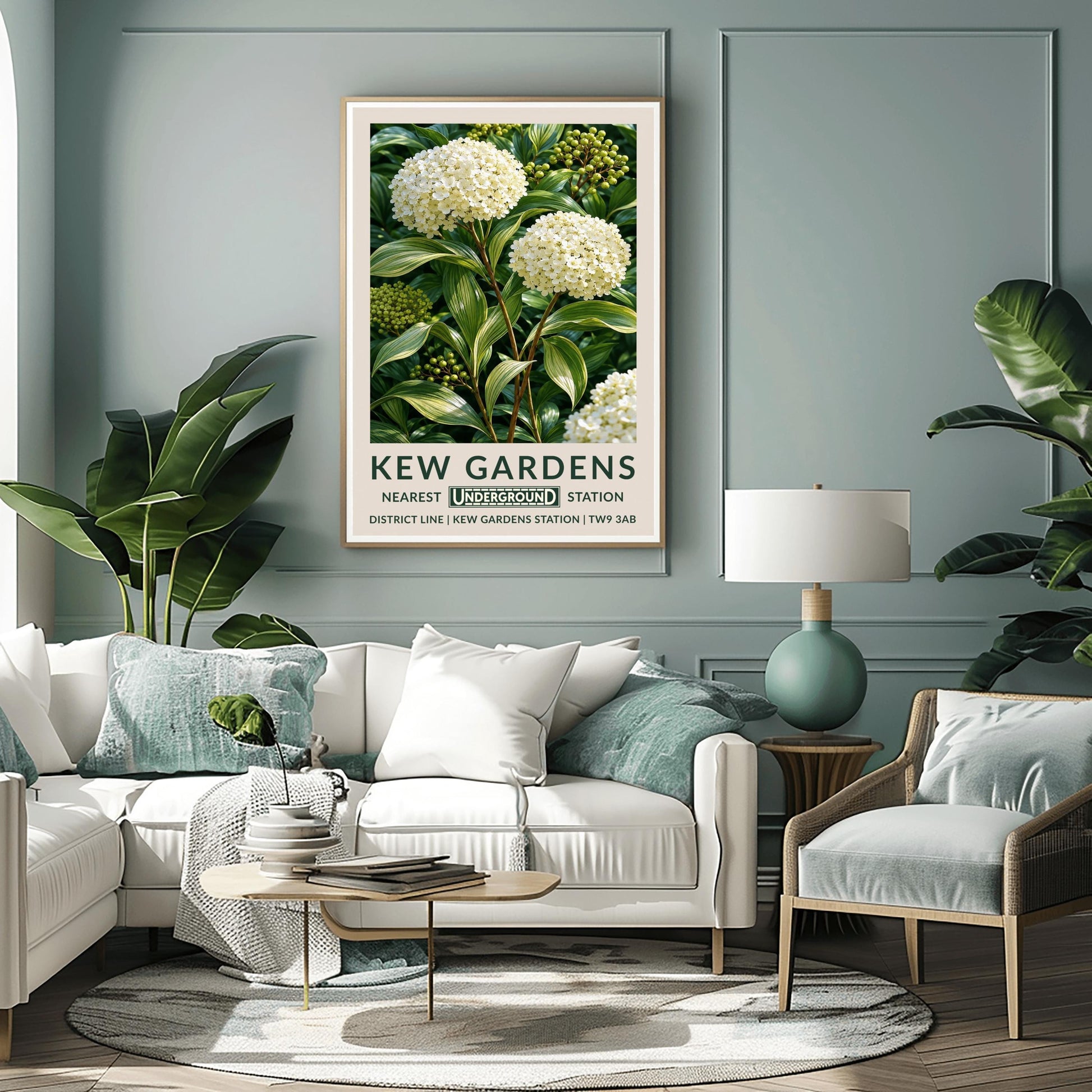 A vertical retro London Underground travel poster for Kew Gardens on a wide cream border. The top image shows a close-up, detailed botanical illustration of two large, round white hydrangea flower clusters surrounded by long, variegated green and white leaves and small green berries. The bottom cream border features the text "KEW GARDENS" in dark green, followed by "NEAREST UNDERGROUND STATION" flanking an authentic boxed Underground logo