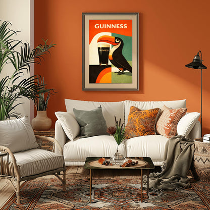A vertical minimalist poster for Guinness in a mid-century modern style. A stylized, geometric toucan stands next to a pint of beer. The background is made of large blocks of orange, teal, and black. Bold white text at the top reads "GUINNESS."