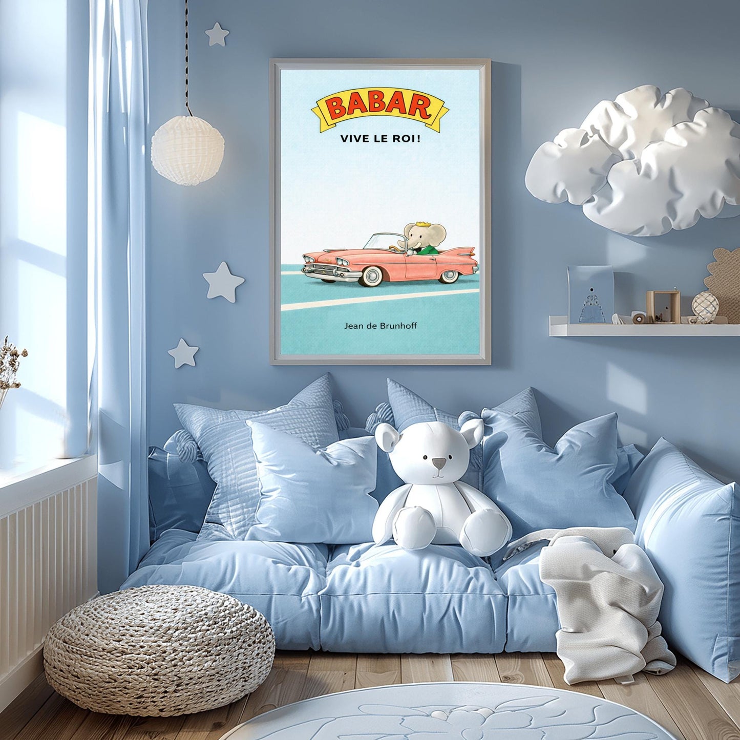 A vertical children's illustration poster. At the top, a yellow banner reads "BABAR" in red letters, with "VIVE LE ROI!" written in black below it. At the bottom, King Babar in a green suit and crown is driving a large, salmon-pink vintage convertible car with white tires. The car is on a simple blue road with white lines, and the background is a solid light blue sky. The name "Jean de Brunhoff" is at the bottom.