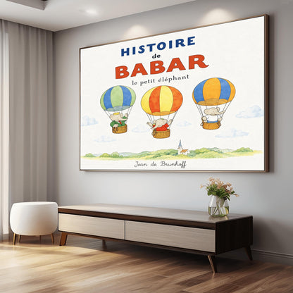 A whimsical vintage-style storybook poster on a clean white background titled "HISTOIRE de BABAR le petit éléphant" in bold blue and orange lettering. The illustration features three cartoon elephants floating in striped hot air balloons over a light green watercolor countryside with a white church steeple. On the left, King Babar in a green suit and crown waves from a blue-and-green balloon. In the center, an elephant in a red dress sits in a yellow-and-orange balloon.