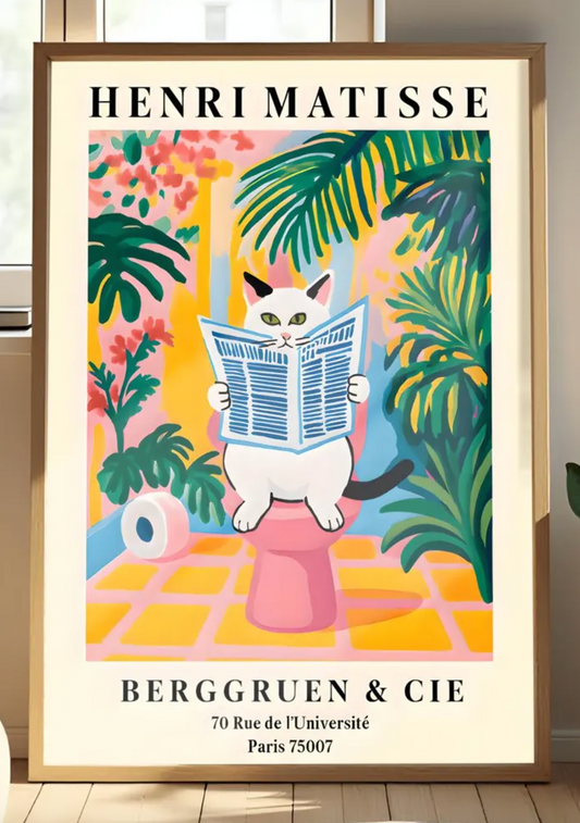 A whimsical, colorful poster in the style of Henri Matisse features an orange and black striped cat with green eyes sitting on a toilet, intently reading a blue-and-white striped newspaper. The bathroom setting is rendered in bold, flat blocks of color, dominated by pink, yellow, and green, with large leafy plants surrounding the cat. A roll of toilet paper is visible to the left. At the top, "HENRI MATISSE" is written in black capital letters.
