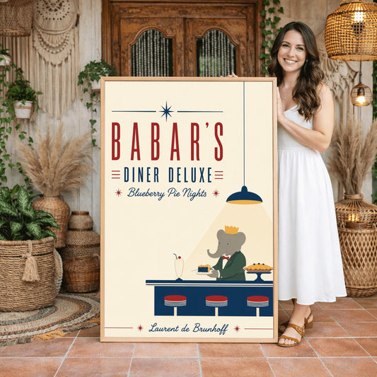 A minimalist graphic vintage-style poster on a solid cream background titled "BABAR'S DINER DELUXE - Blueberry Pie Nights" in bold red and blue typography. At the bottom right, the cartoon elephant King Babar wears a green suit and gold crown behind a dark blue counter. A single blue hanging lamp projects a sharp triangle of yellow light over him as he holds a plate with a slice of blueberry pie. On the counter sit three red-topped stools, a vintage milkshake, and a whole pie on a stand.