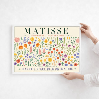A vertical gallery exhibition poster with a warm cream border. Bold black text at the top reads "HENRI MATISSE". The central artwork is a rectangular block with a solid terracotta-orange background, featuring a cream silhouette of an abstract, four-petaled flower with a circular center. Below the block, black text reads "PAPIERS DÉCOUPÉS" and "FLEUR". The bottom of the poster finishes with the text "BERGGRUEN & CIE - 70 RUE DE L'UNIVERSITÉ - PARIS VII".