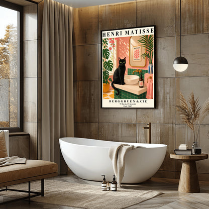 A vertical art print styled as a Henri Matisse exhibition poster. A sleek black cat with bright green eyes sits on a cream-colored bathroom vanity next to a white vessel sink. The bathroom features blush pink walls and emerald green tiles. A gold-framed mirror reflects a Matisse leaf print. Lush green plants and pink flowers frame the scene, and dappled sunlight creates shadows on the wall. The poster has bold black text at the top and bottom with the gallery name Berggruen & Cie.