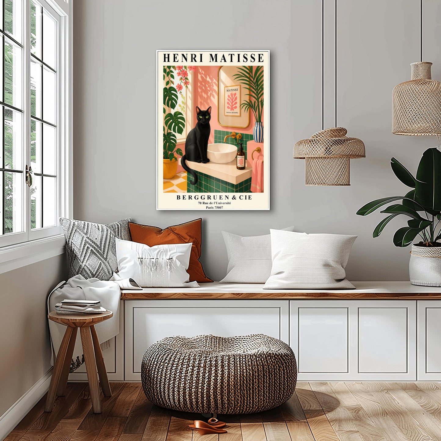 A vertical art print styled as a Henri Matisse exhibition poster. A sleek black cat with bright green eyes sits on a cream-colored bathroom vanity next to a white vessel sink. The bathroom features blush pink walls and emerald green tiles. A gold-framed mirror reflects a Matisse leaf print. Lush green plants and pink flowers frame the scene, and dappled sunlight creates shadows on the wall. The poster has bold black text at the top and bottom with the gallery name Berggruen & Cie.
