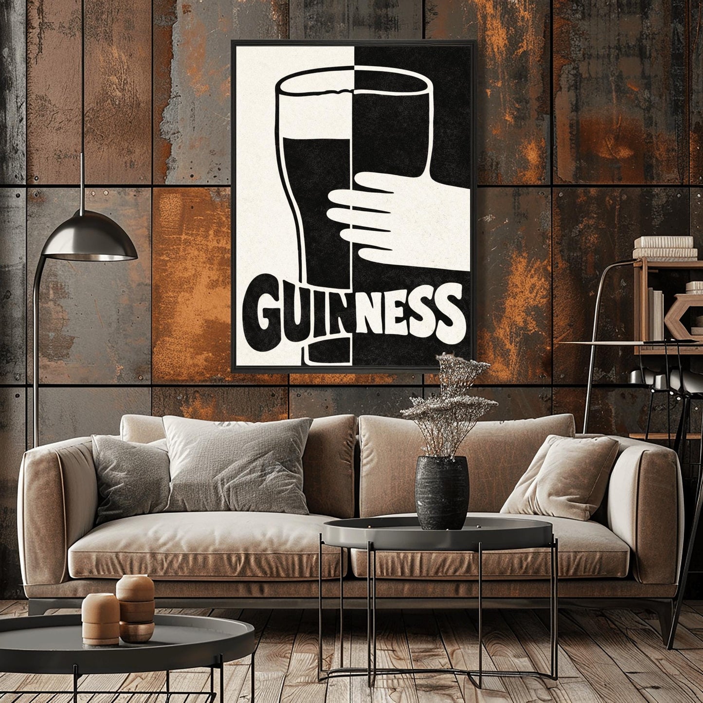 A vertical minimalist graphic split down the center: the left half is cream and the right half is black. A large Guinness pint in the center reverses its colors across the split. A white hand holds the glass from the right. The word "GUINNESS" at the bottom also reverses colors across the divide.
