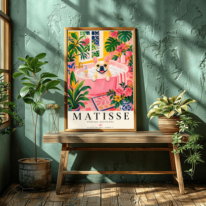 A vertical maximalist art print styled as a Henri Matisse exhibition poster. A tan and white French Bulldog with a wide, happy smile sits in a pink bathtub filled with white bubbles. The bathroom is vibrant with pink tiled floors, yellow walls, and a large window looking out onto a garden. The scene is filled with tropical plants like Monstera and Birds of Paradise. Bold black text at the bottom reads "MATISSE PAPIERS DÉCOUPÉS" with a Paris gallery address.