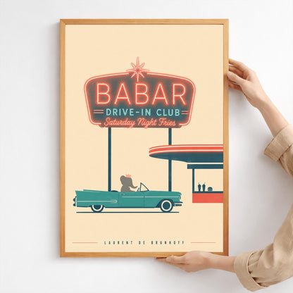 A minimalist graphic vintage-style poster on a solid cream background. At the top, a large retro neon-style sign glows with a red border and teal lettering that reads "BABAR DRIVE-IN CLUB - Saturday Night Fries". Below the sign, a silhouette of a cartoon elephant wearing a crown sits inside a classic teal 1950s convertible car. The car is parked next to a simplified red and teal drive-in order window featuring two milkshakes and a burger silhouette.