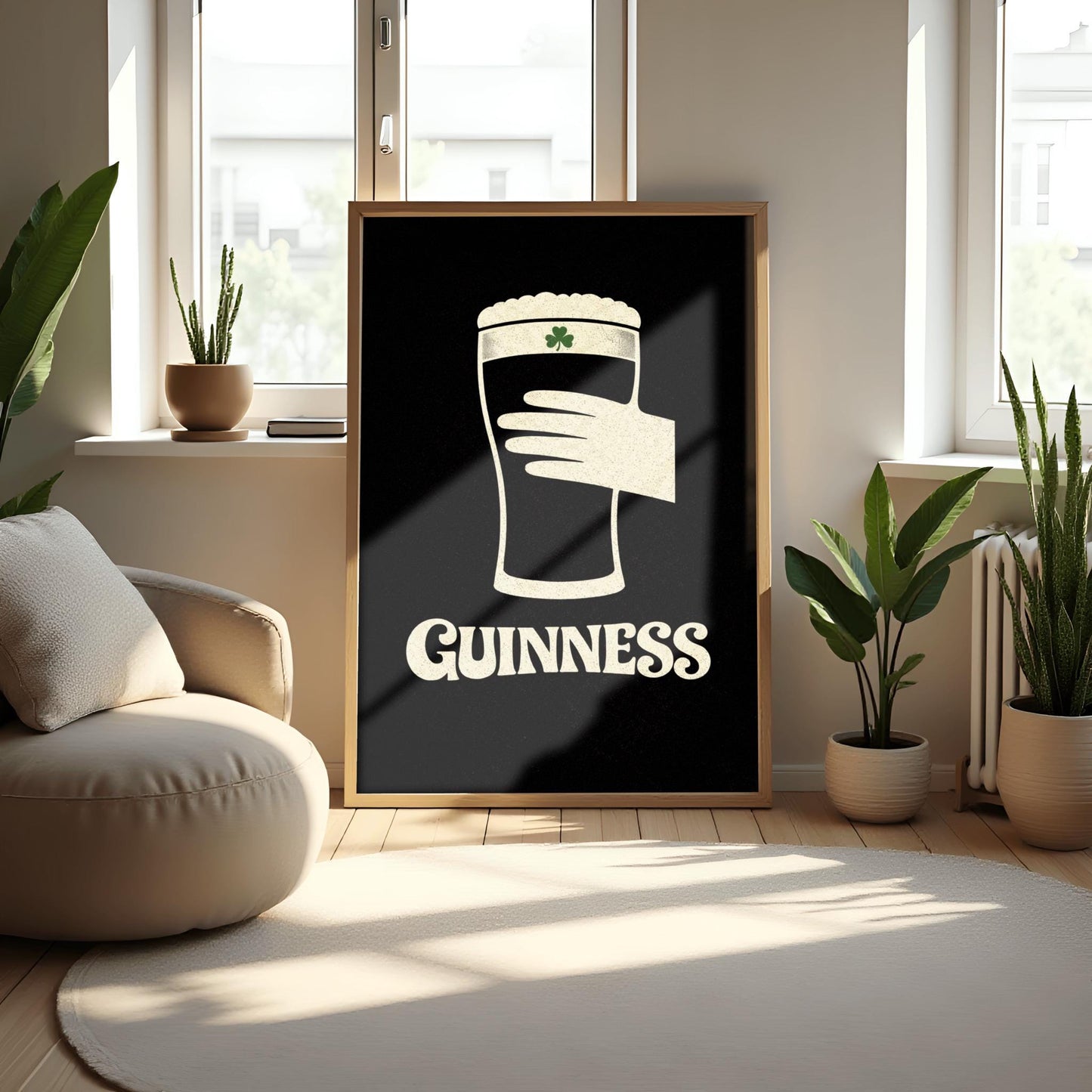 A vertical minimalist graphic design on a textured black background. A cream-colored hand is shown holding a pint of Guinness stout, with the glass itself created out of negative space. A small green shamrock is on the foam. The word "GUINNESS" is in cream text at the bottom.